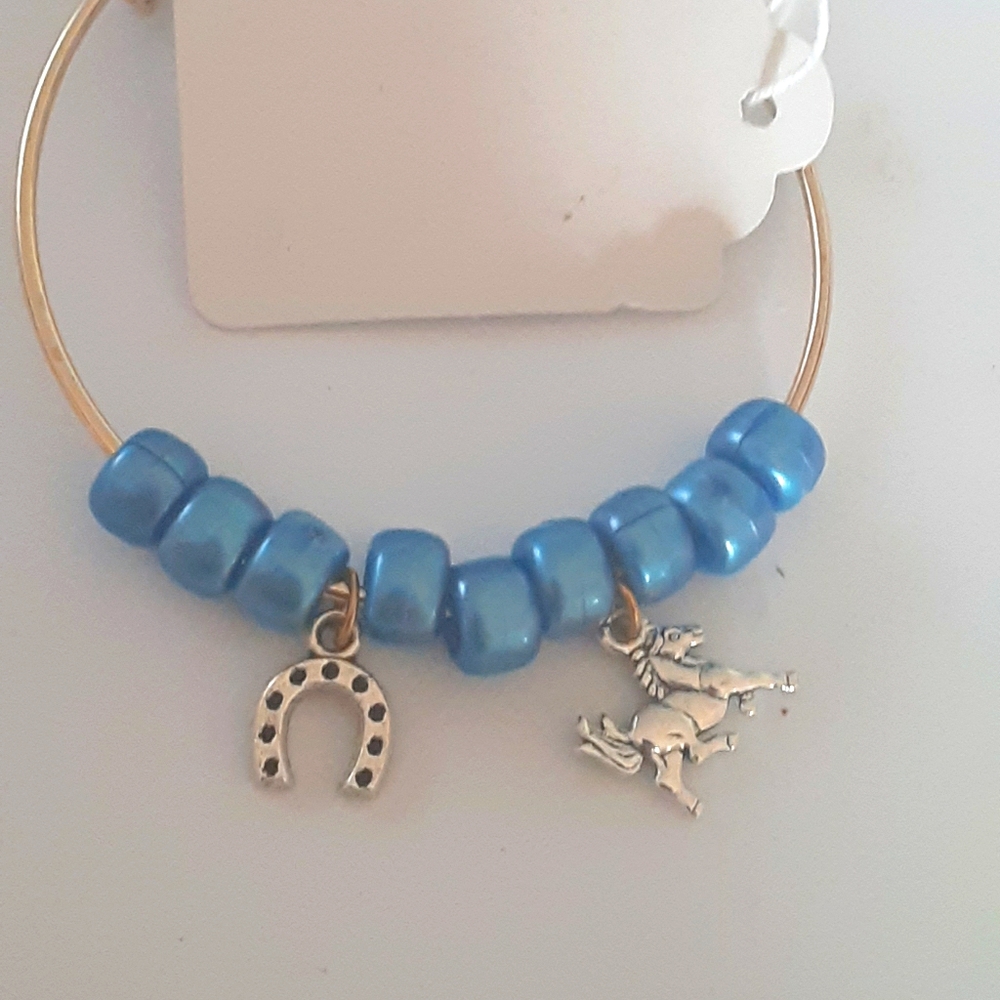 Adjustable bangle bracelet with charms